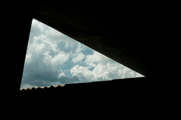 Lockdown Series photo: triangle of sky framed by eaves of a building