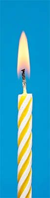 Yellow candle symbolizing creative coaching insight