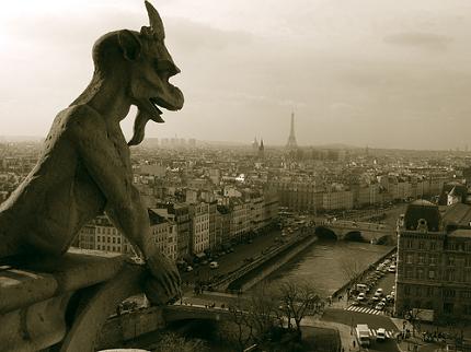 Gargoyle on the Cathedral of Notre Dame, overlooking the city of Paris