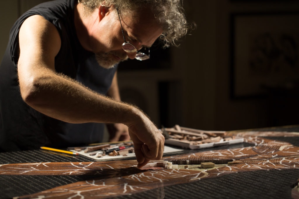 John T Unger working on mosaic