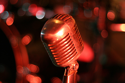 Microphone waiting on brightly lit stage