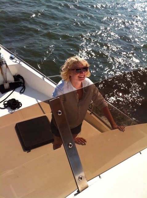 Emily Kimelman grinning on the boat