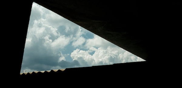 Lockdown Series photo: triangle of sky framed by eaves of a building