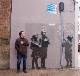 Mark with Banksy graffiti