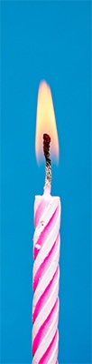 Pink candle symbolizing creative coaching insight
