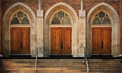 three arched doors on church facade