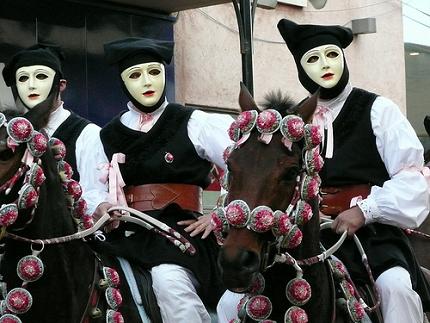 Masked riders on horseback