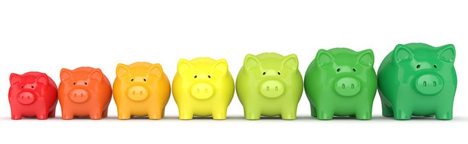 Colored piggy banks in a row