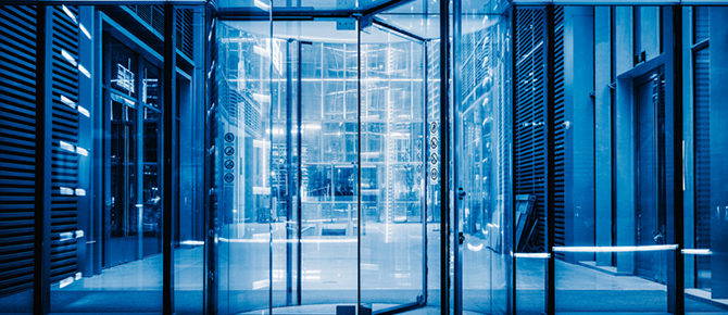 Revolving door in glass-fronted building