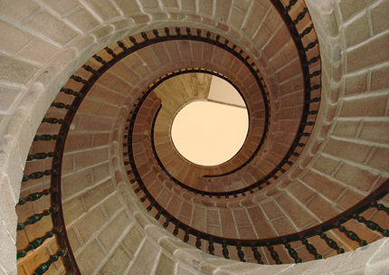Looking upward at a spiral staircase